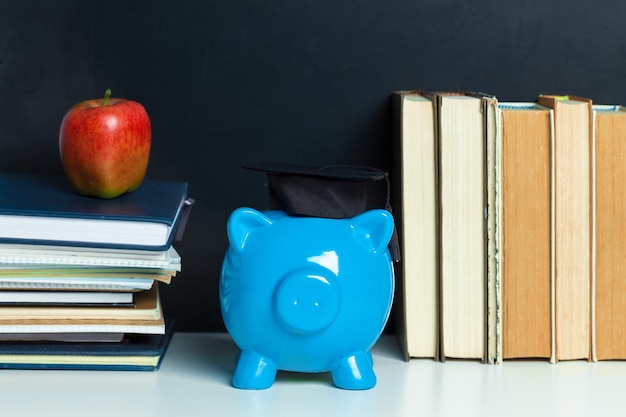 Free photo college graduate student diploma piggy bank