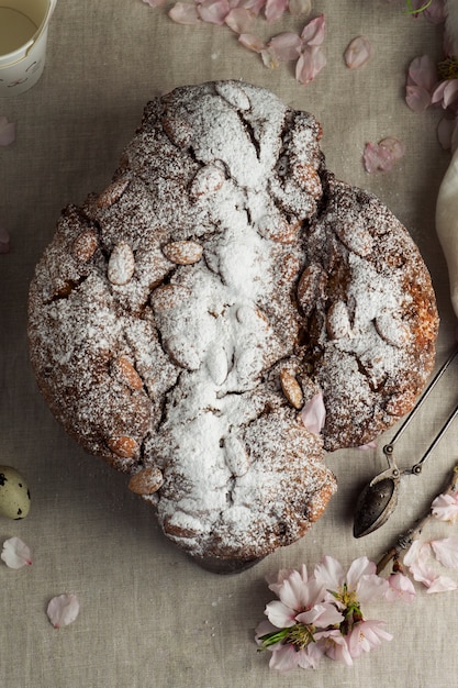 Colomba with powder and flowers top view