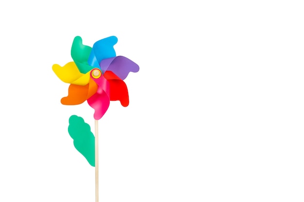 A colored big pinwheel on a yellow background with copy space