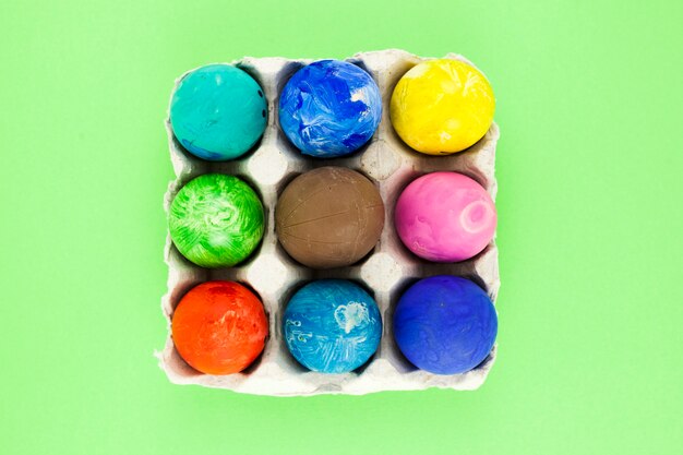 Colored eggs in carton