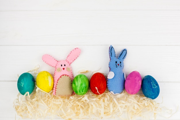 Colored eggs near cute bunnies