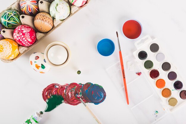 Colored eggs near paints