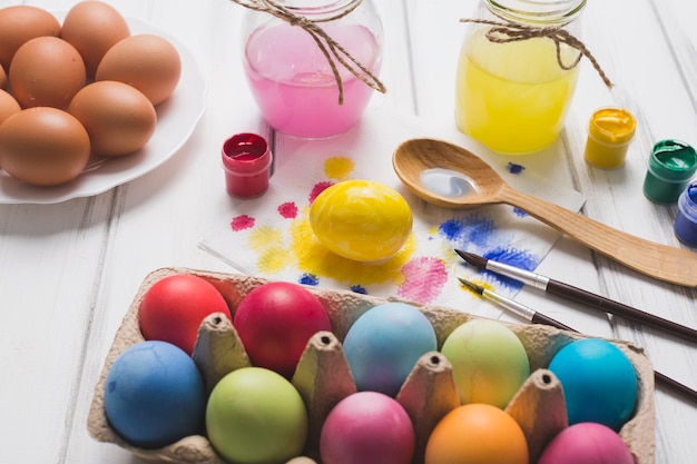 Free photo colored eggs and paints composition