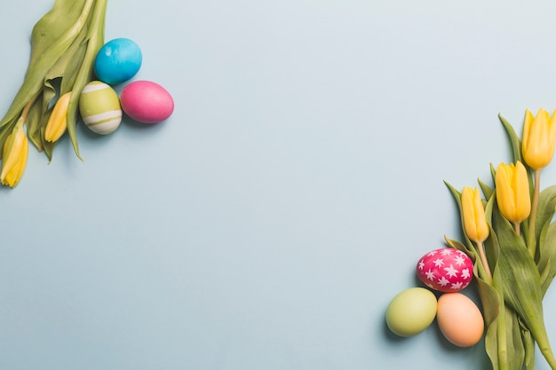 Free Photo | Colored eggs and tulips