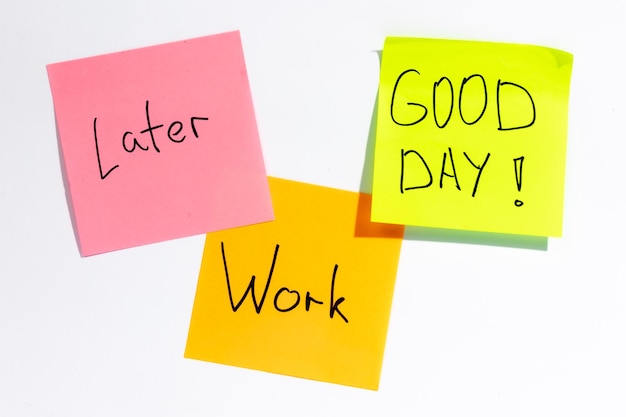 Free photo colored paper reminders on white background office work concept