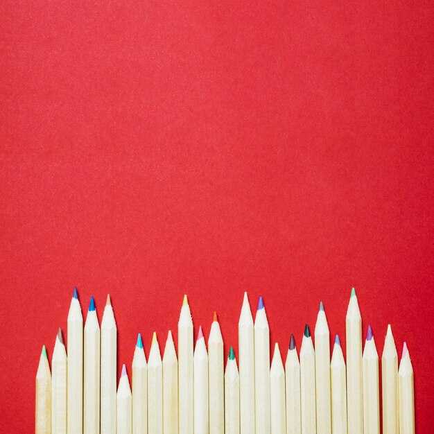 colored pencils lying in line