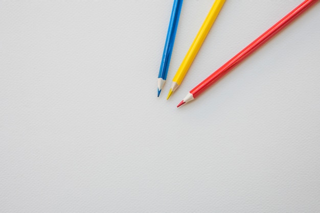 Colored pencils lying on paper