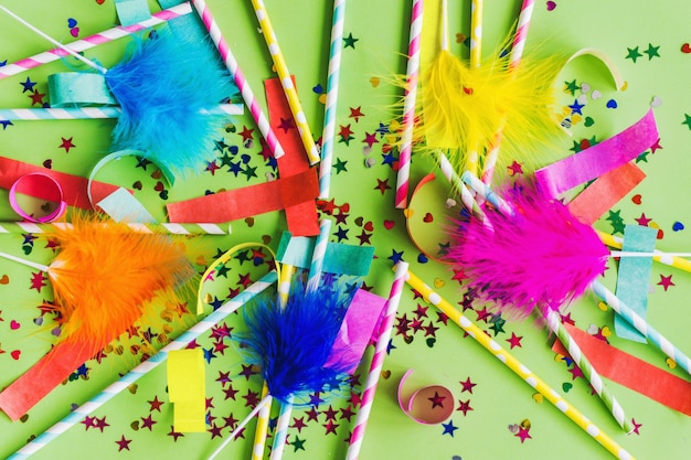 Free photo colored sticks with feathers above