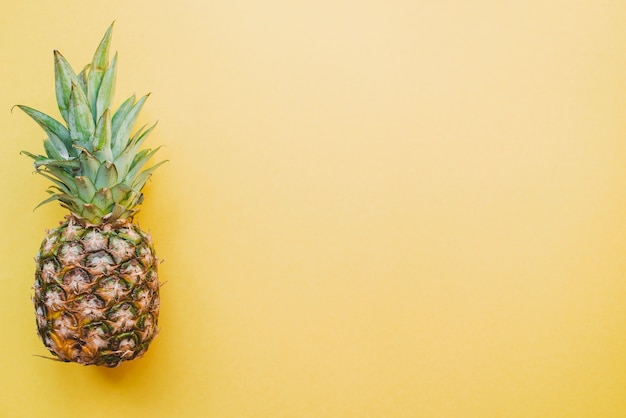 Free photo colored surface with pineapple