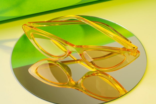 Free photo colored transparent sunglasses  still life