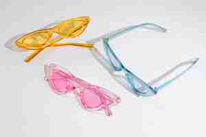 Free photo colored transparent sunglasses  still life