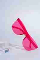 Free photo colored transparent sunglasses  still life