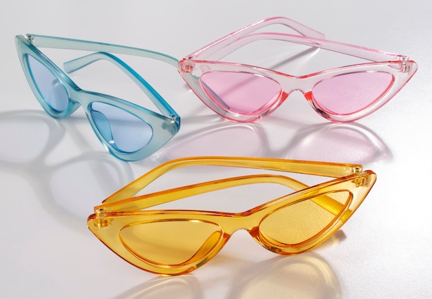 Free photo colored transparent sunglasses  still life