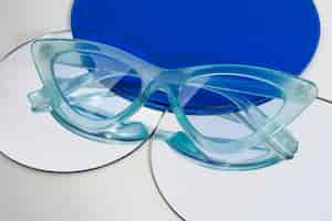 Free photo colored transparent sunglasses  still life