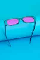 Free photo colored transparent sunglasses  still life