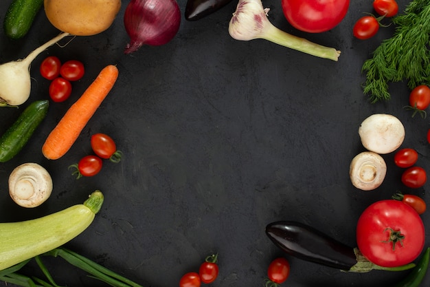 Colored vegetables fresh on dark background