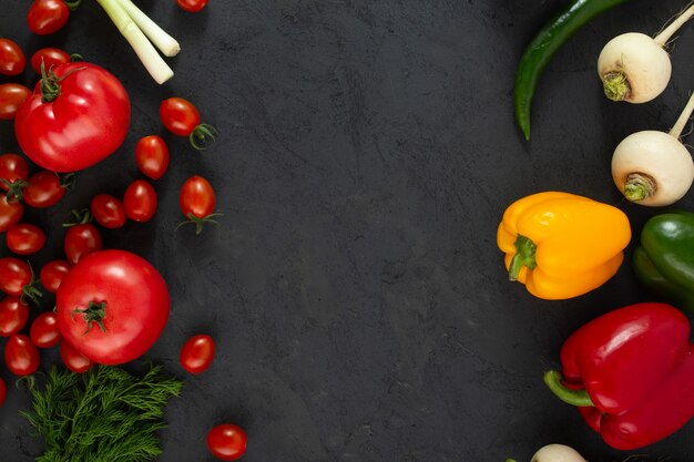 Colored vegetables fresh ripe salad vegetables on grey desk