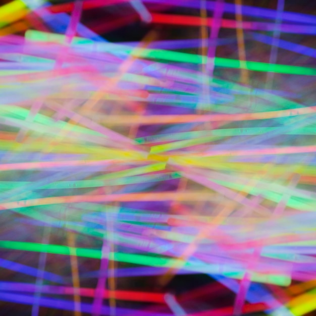 カラフルな抽象的なネオン光のチューブの背景
