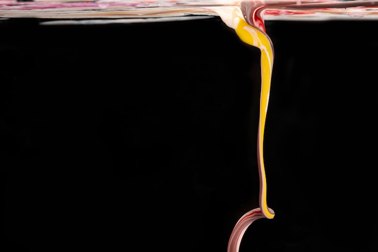 Free Photo colorful acrylic shape in water on black background