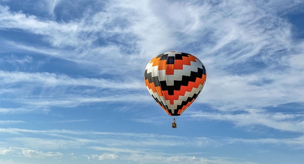 Colorful air balloon flying in the sk