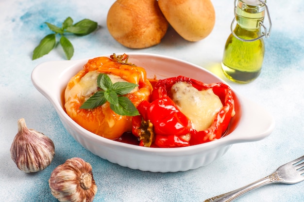 Free photo colorful baked with cheese, stuffed peppers with minced meat.