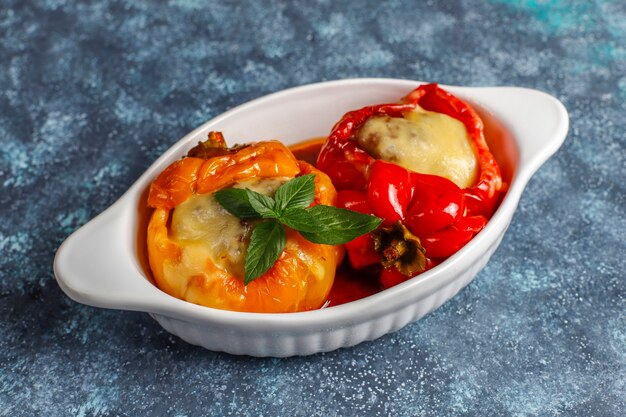 Colorful baked with cheese, stuffed peppers with minced meat.