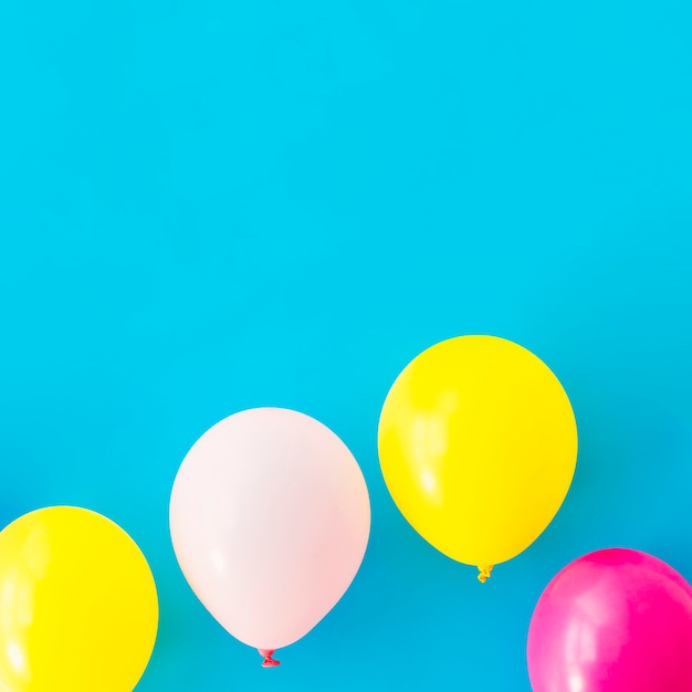 Colorful balloons on blue background