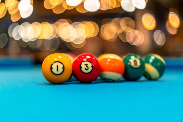 Colorful balls on a blue pool table