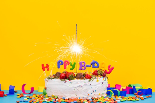 Colorful birthday cake with sparkler