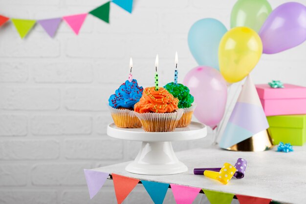 Colorful birthday party cupcakes with candles