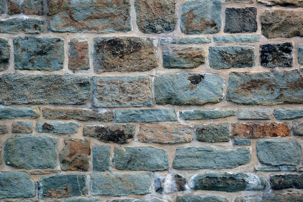 Free photo colorful brick wall background from old building in quebec city