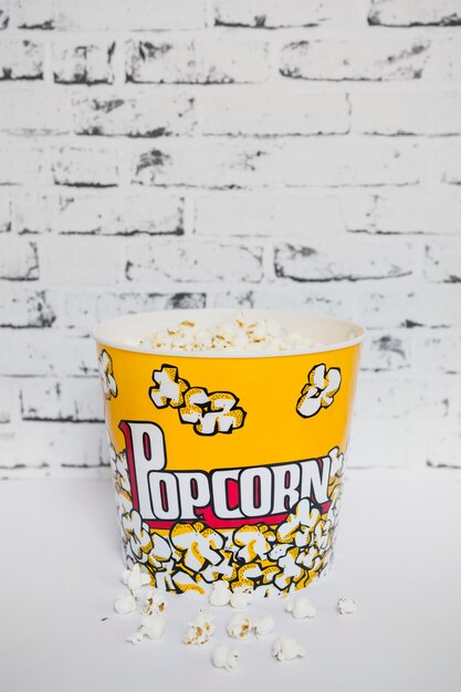 Colorful bucket of popcorn on white