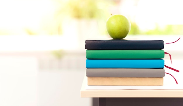 Free photo colorful bunch of books on desk