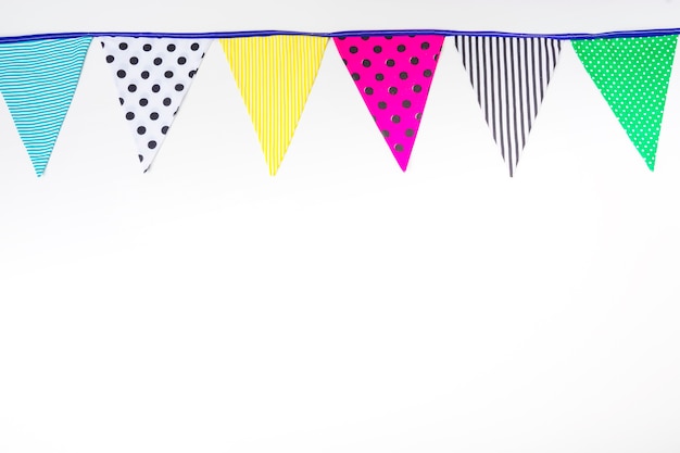 Colorful bunting flags on white background
