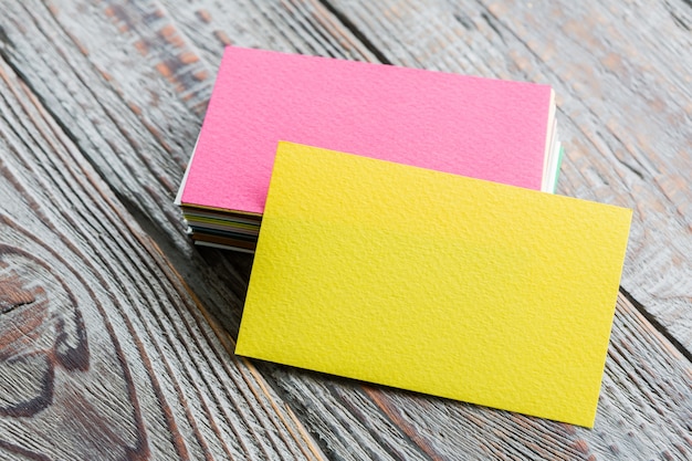 Colorful business cards on wooden table