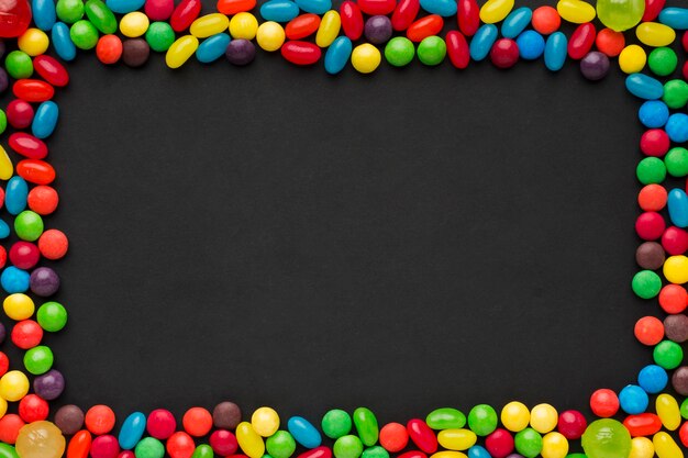 Colorful candies frame with copy space