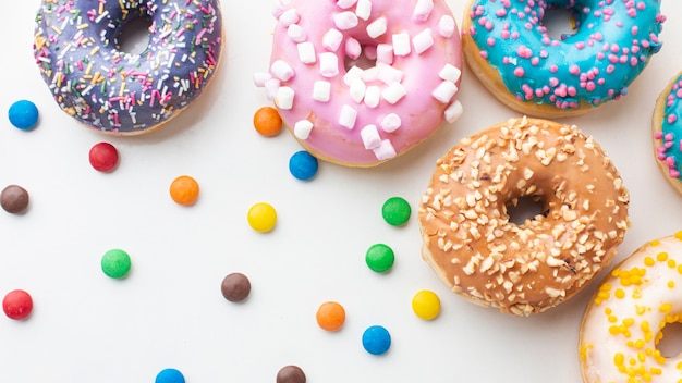 Colorful candy and donuts close up