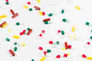 Free photo colorful capsules spread on white background