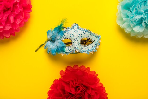 Colorful carnival objects on yellow background