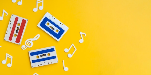 Colorful cassette tapes on bright background with copy-space