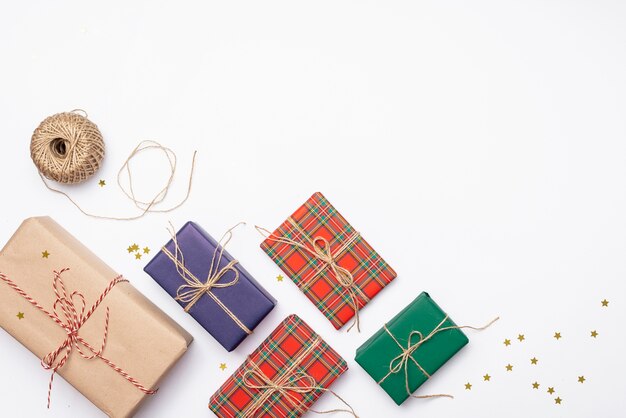 Colorful christmas presents with golden stars and string