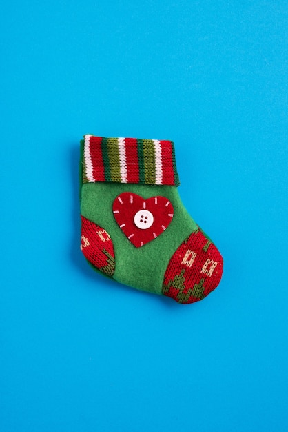 Colorful christmas sock in the blue background