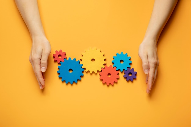 Colorful cogwheels arrangement flat lay