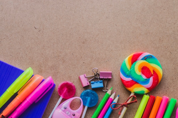 Colorful composition of supplies and lollipops