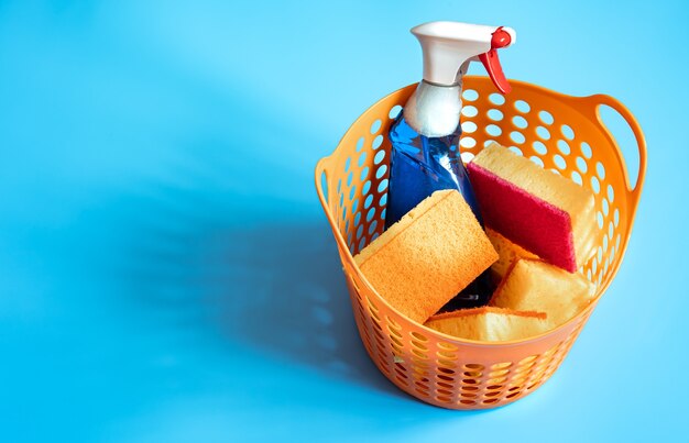 Free photo colorful composition with a set of bright cleaning sponges and cleaning agent. cleaning service concept  background