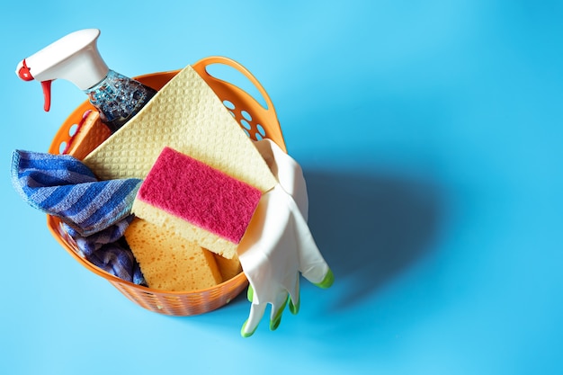 Colorful composition with a set of bright cleaning sponges and cleaning agent. Cleaning service concept.