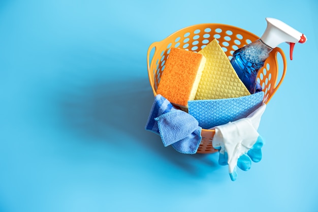 Colorful composition with sponges, rags, gloves and detergent for cleaning. Top view