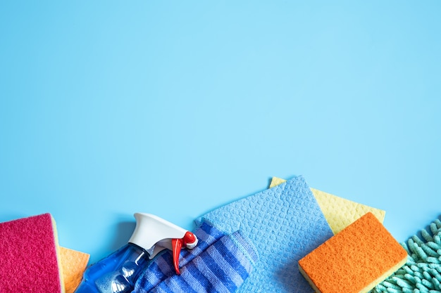 Colorful composition with sponges, rags, gloves and detergent for general cleaning. Cleaning service concept.