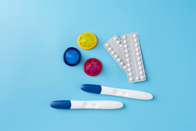 Colorful condoms arrangement flat lay