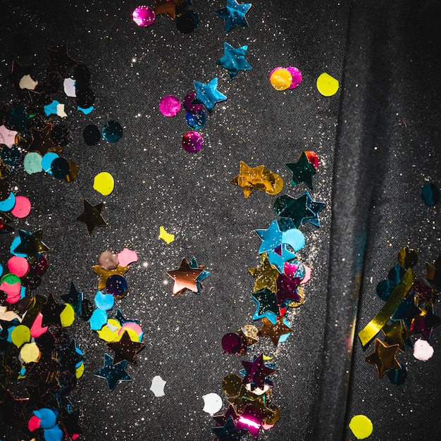 Free photo colorful confetti on floor after party